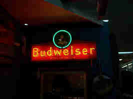 A neon Budweiser sign, hanging in a booth in the Glenwood Antique Mall.
